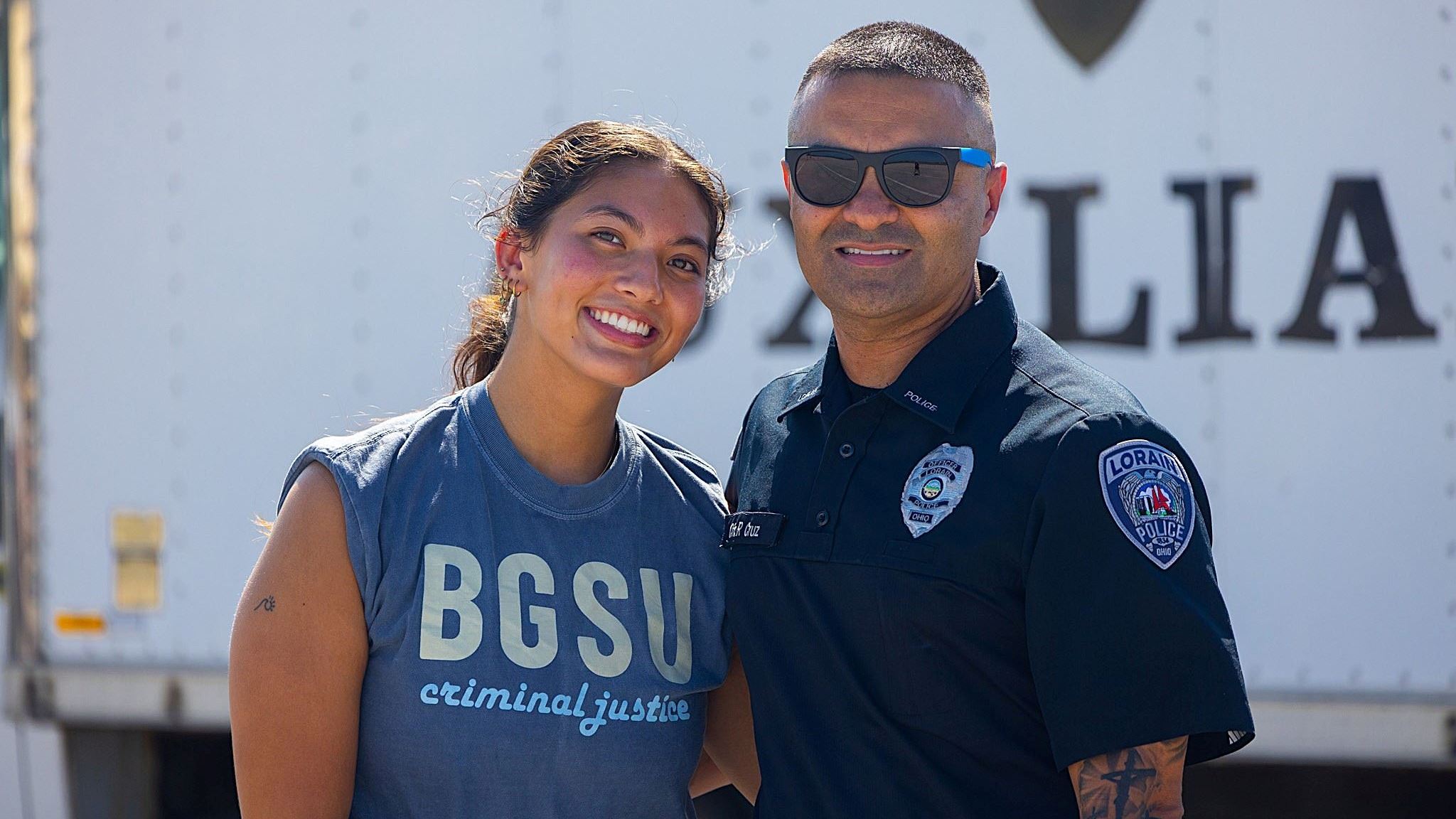 Officer beside a member of the community