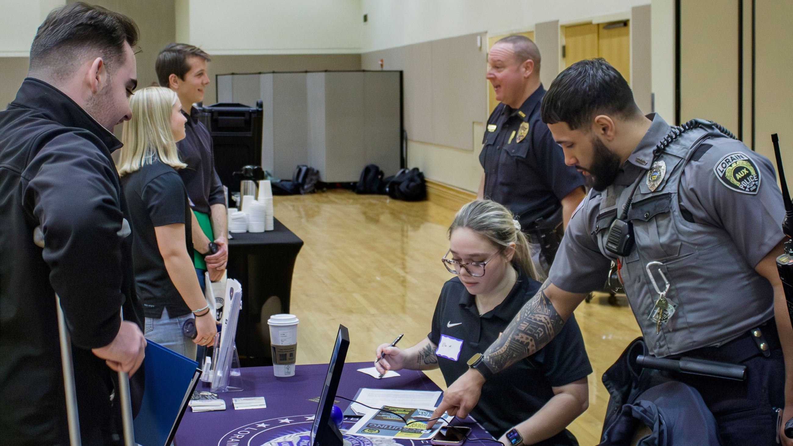 School Resource Officer helping aid students 